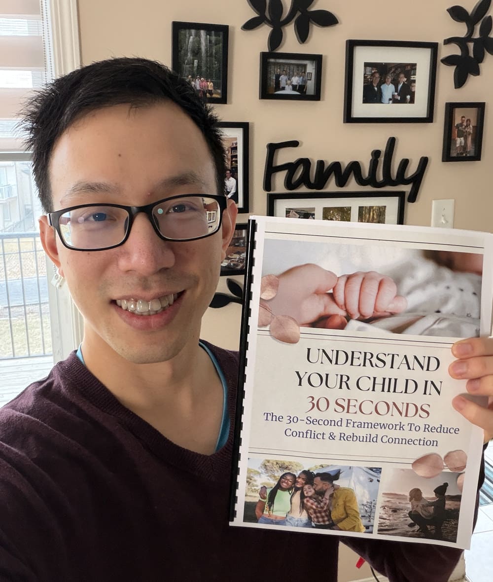Ian holding a printed copy of Understand Your Child in 30 Seconds