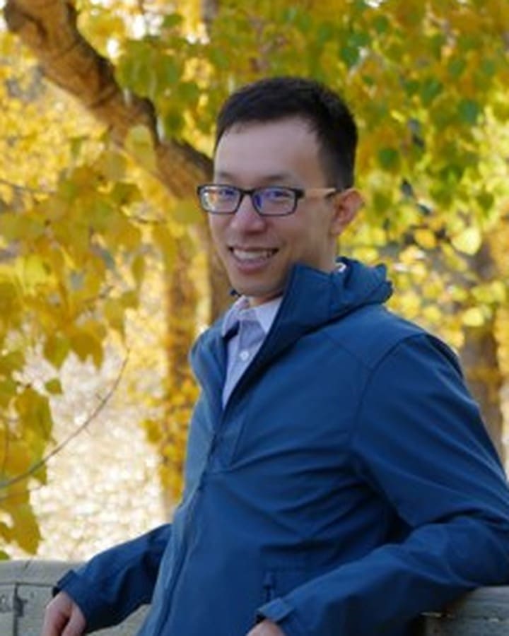 Ian Lin outside on an autumn day