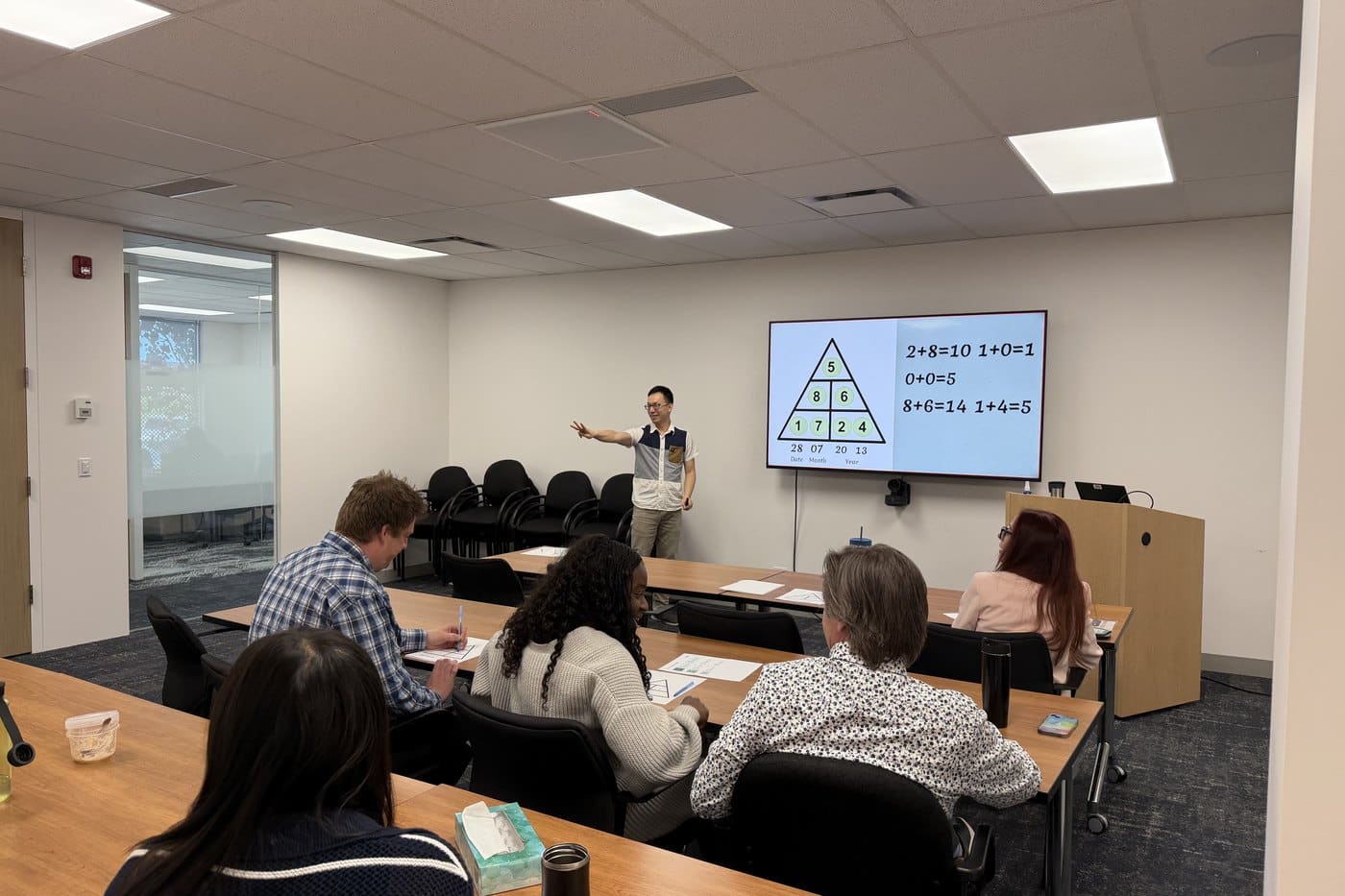Ian teaching a room of parents